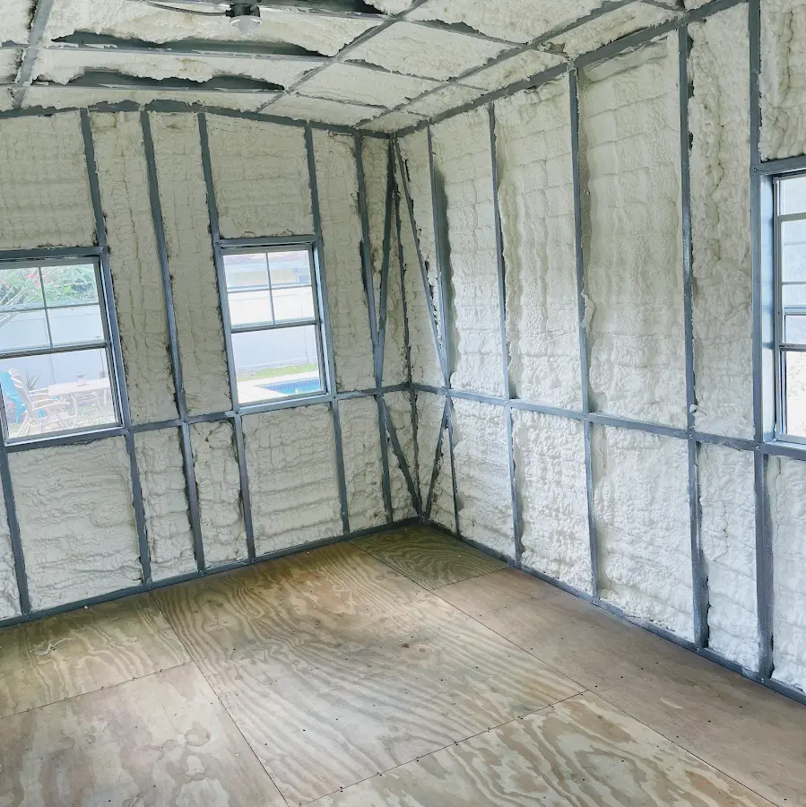 Closed-cell spray foam insulation applied to wall cavities in a residential project in Ansonia